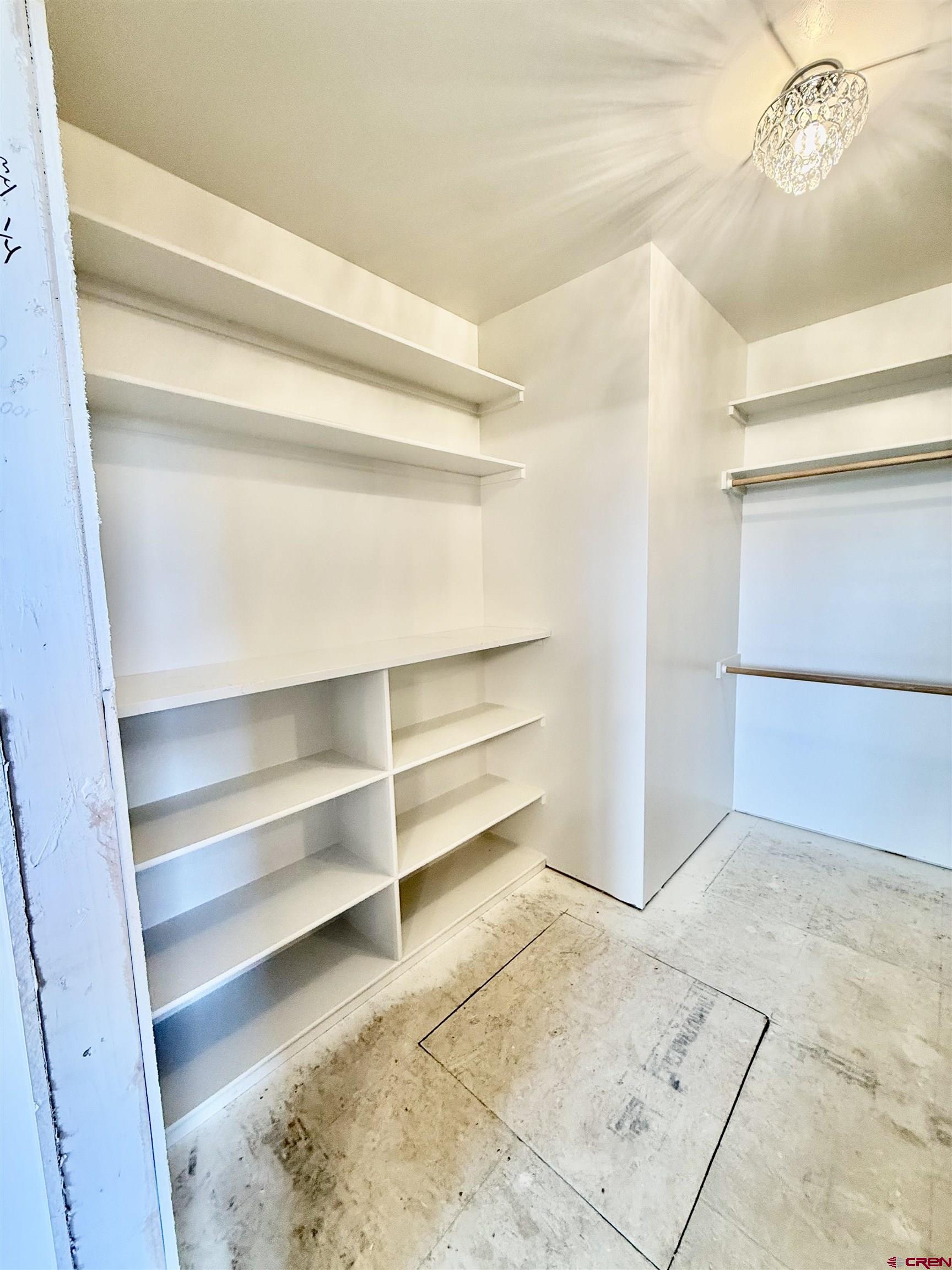 21470 Government Springs Road Montrose, CO 81403 - Photo 16 of 25 a view of walk in closet with empty racks