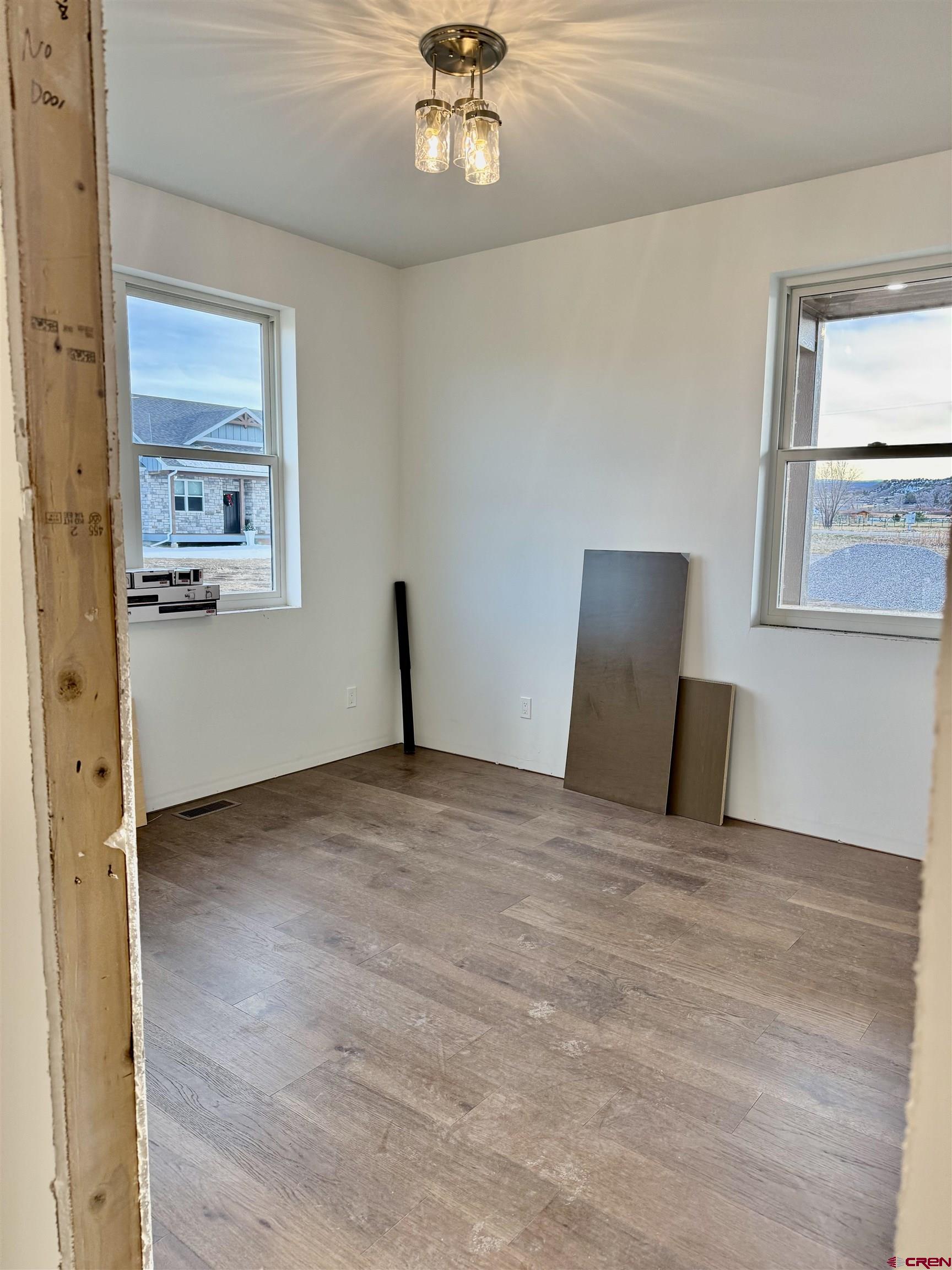 21470 Government Springs Road Montrose, CO 81403 - Photo 19 of 25 a view of empty room with wooden floor
