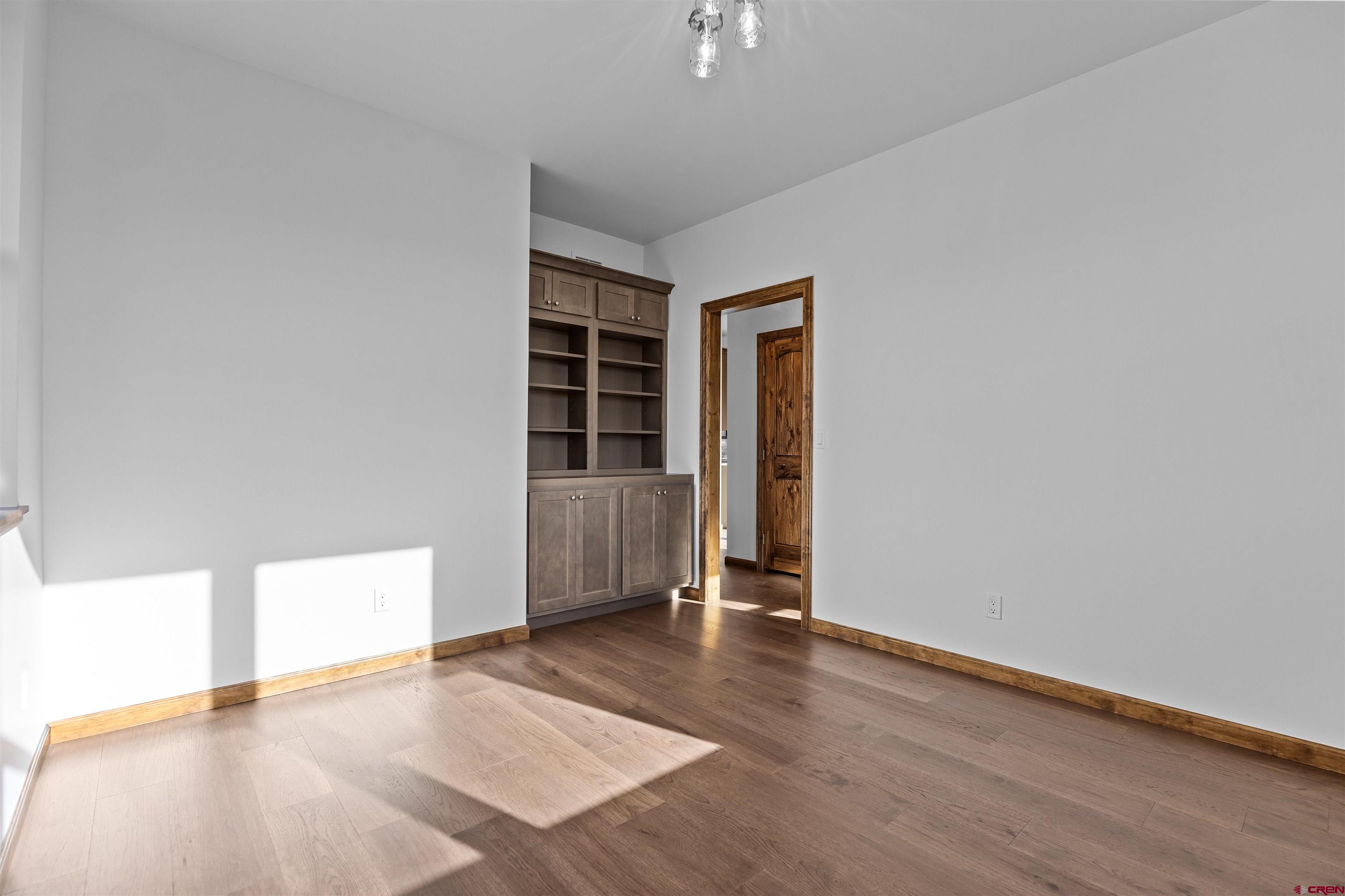 21470 Government Springs Road Montrose, CO 81403 - Photo 26 of 42 wooden floor in an empty room