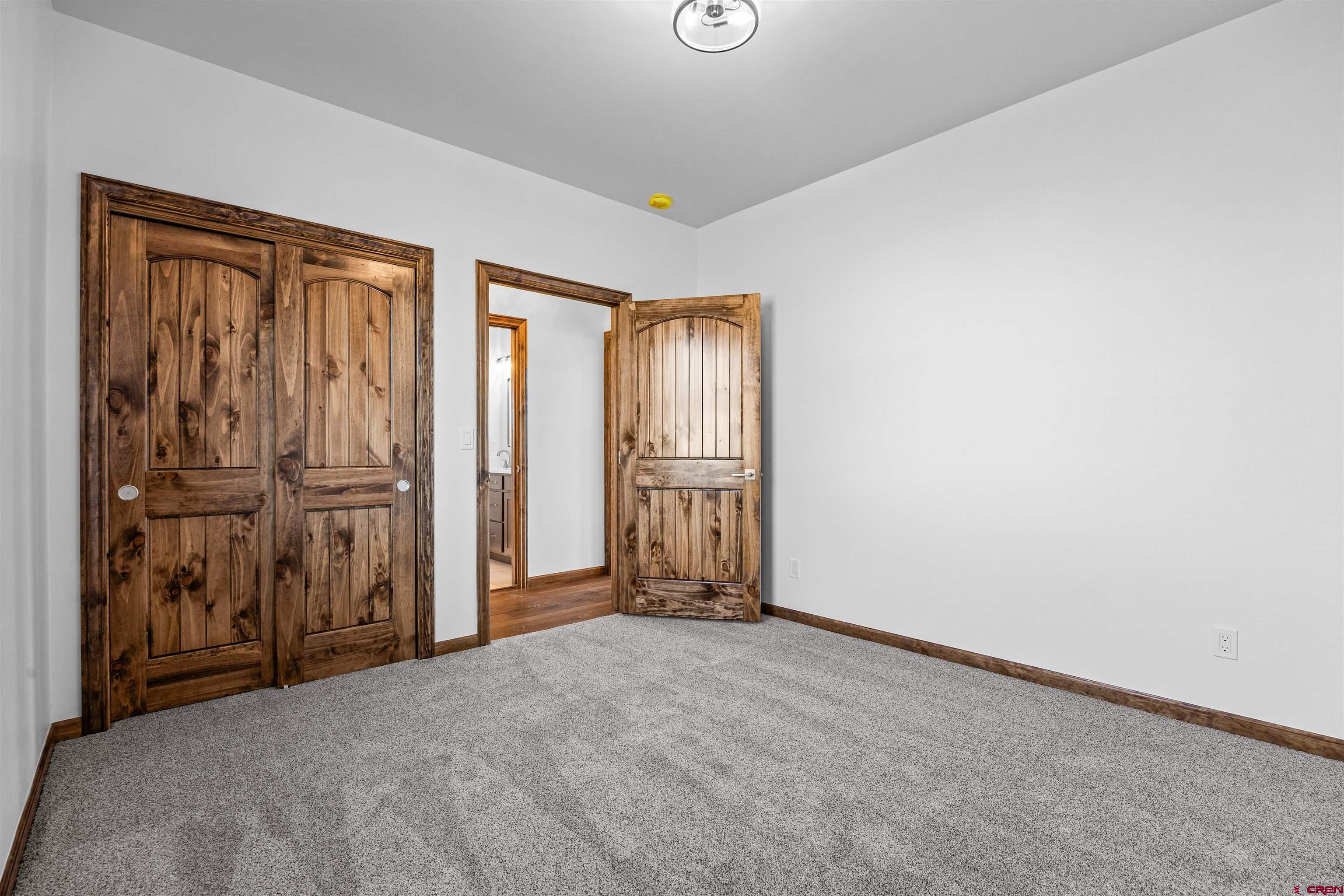 21470 Government Springs Road Montrose, CO 81403 - Photo 27 of 42 an empty room with windows