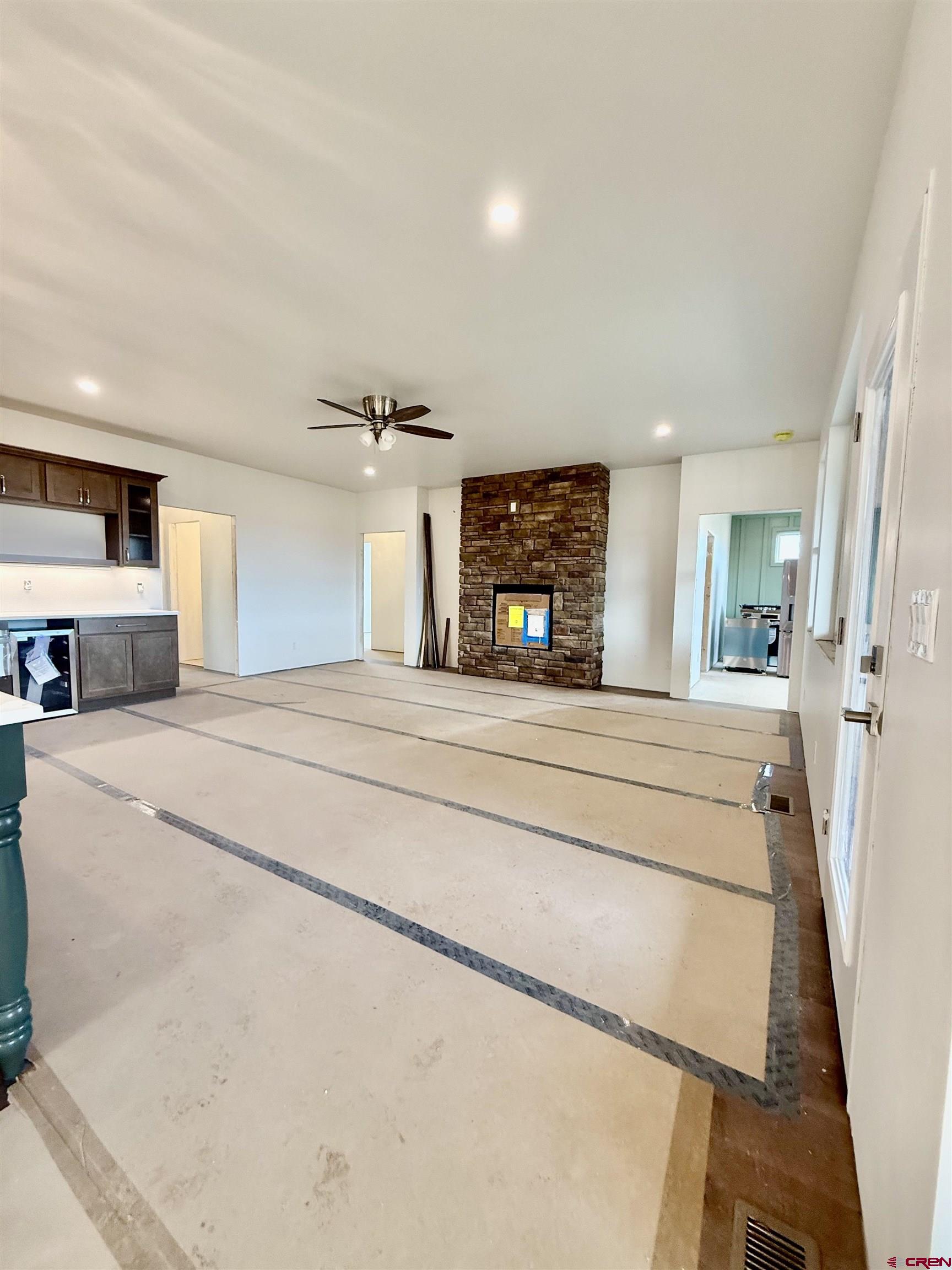 21470 Government Springs Road Montrose, CO 81403 - Photo 4 of 25 a bedroom with furniture and a fireplace