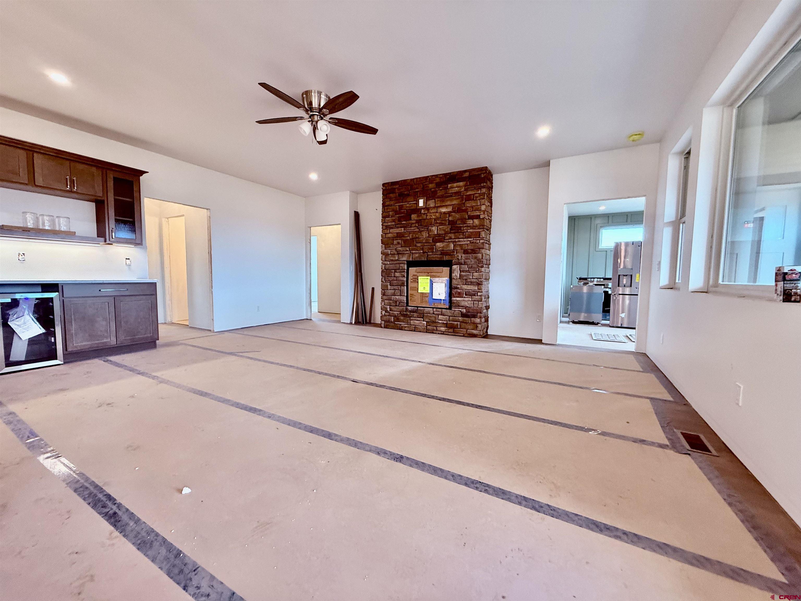 21470 Government Springs Road Montrose, CO 81403 - Photo 5 of 25 a view of a kitchen with cabinets and wooden floor