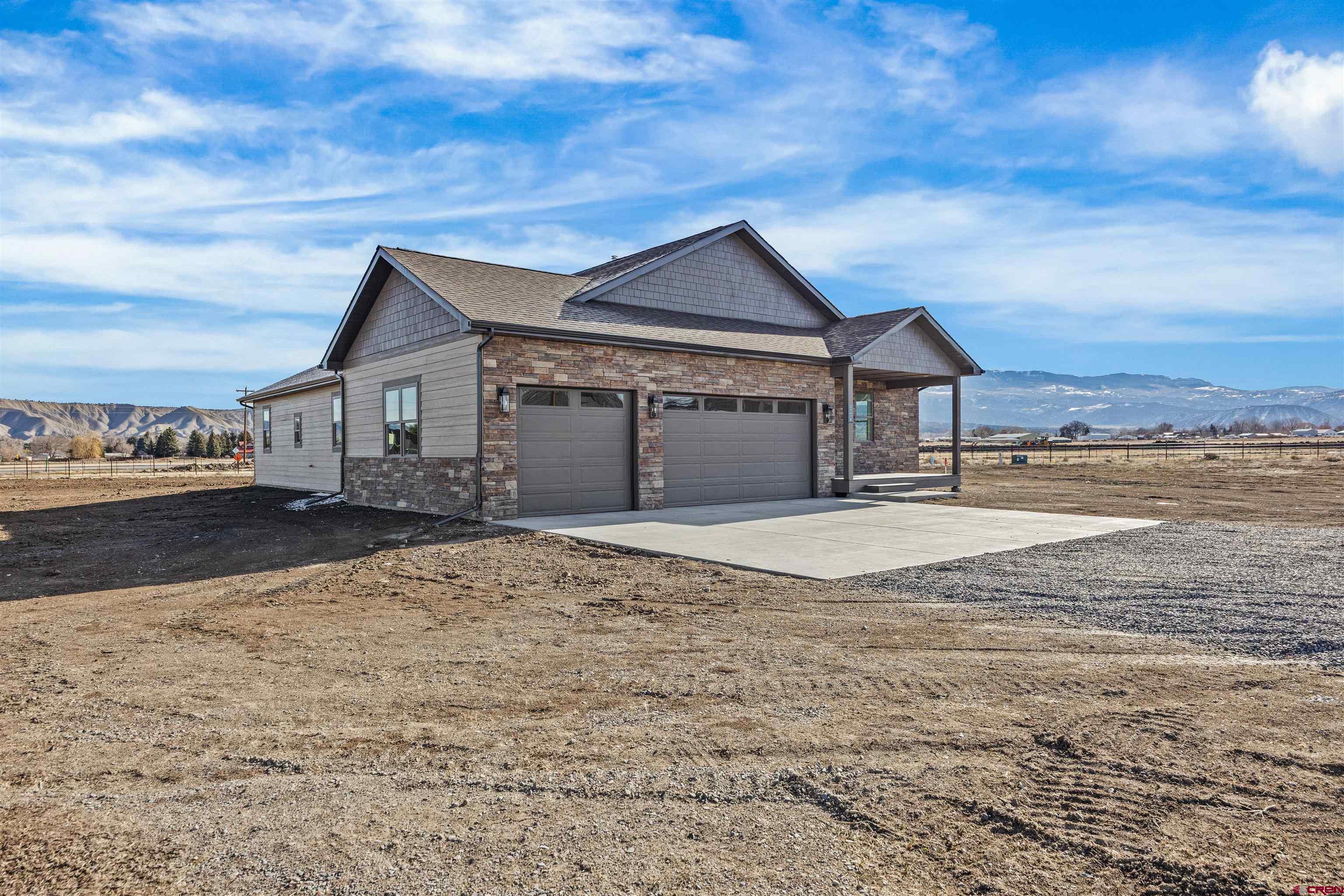 21470 Government Springs Road Montrose, CO 81403 - Photo 5 of 42 a view of a house with a yard