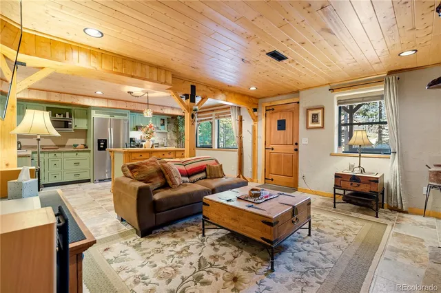 a view of a lush green hillside and a building