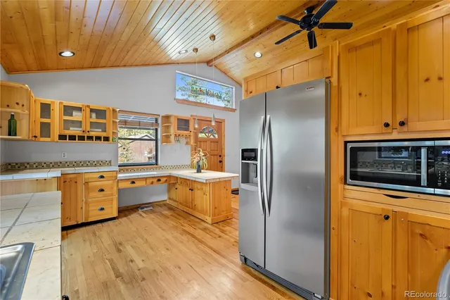 a view of a livingroom with wooden floor