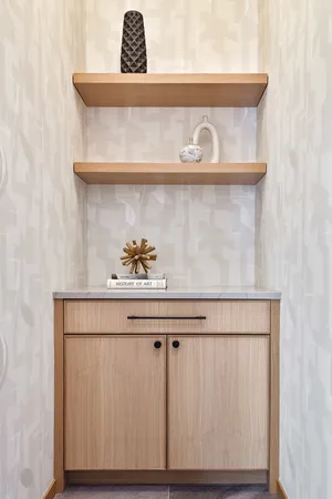 a spacious bedroom with a bed and a lamp