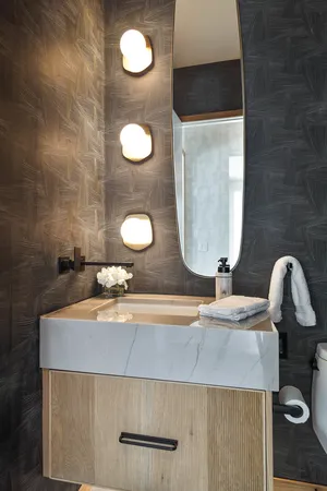 a spacious bathroom with a granite countertop sink a mirror a shower and a bathtub
