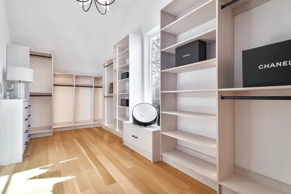 a bathroom with a toilet sink and a mirror