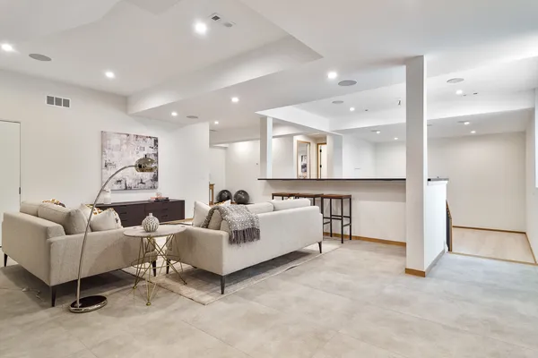 a living room with furniture and a table