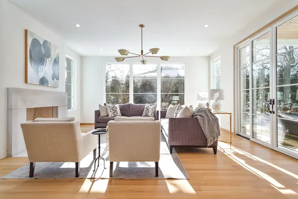 a living room with furniture and a fireplace
