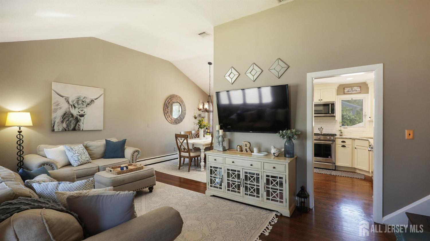 47 Miliken Road Colonia, NJ 07067 - Photo 7 of 40 a living room with furniture and a flat screen tv