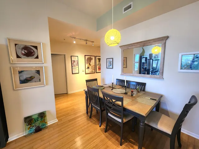 a view of a dining room with furniture and wooden floor