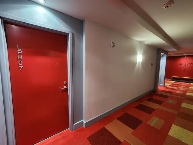 an empty room with wooden floor