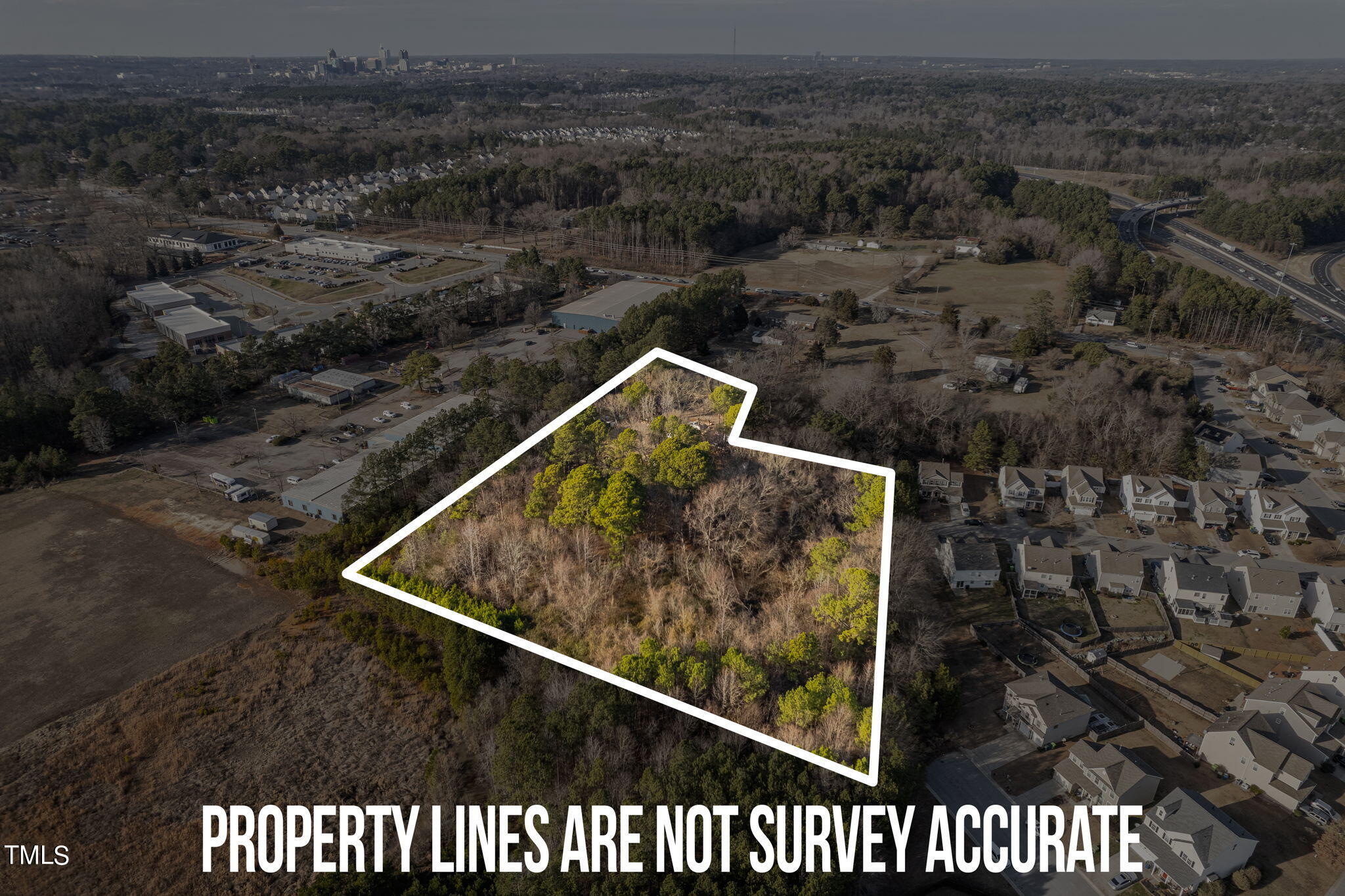 3030 Rock Quarry Road Raleigh, NC 27610 - Photo 3 of 15 a view of a back yard