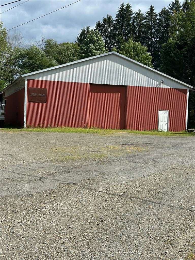 177 Baker Hill Road Otego, NY 13825 - Photo 34 of 45 Pole Barn - 5 overhead truck bays.