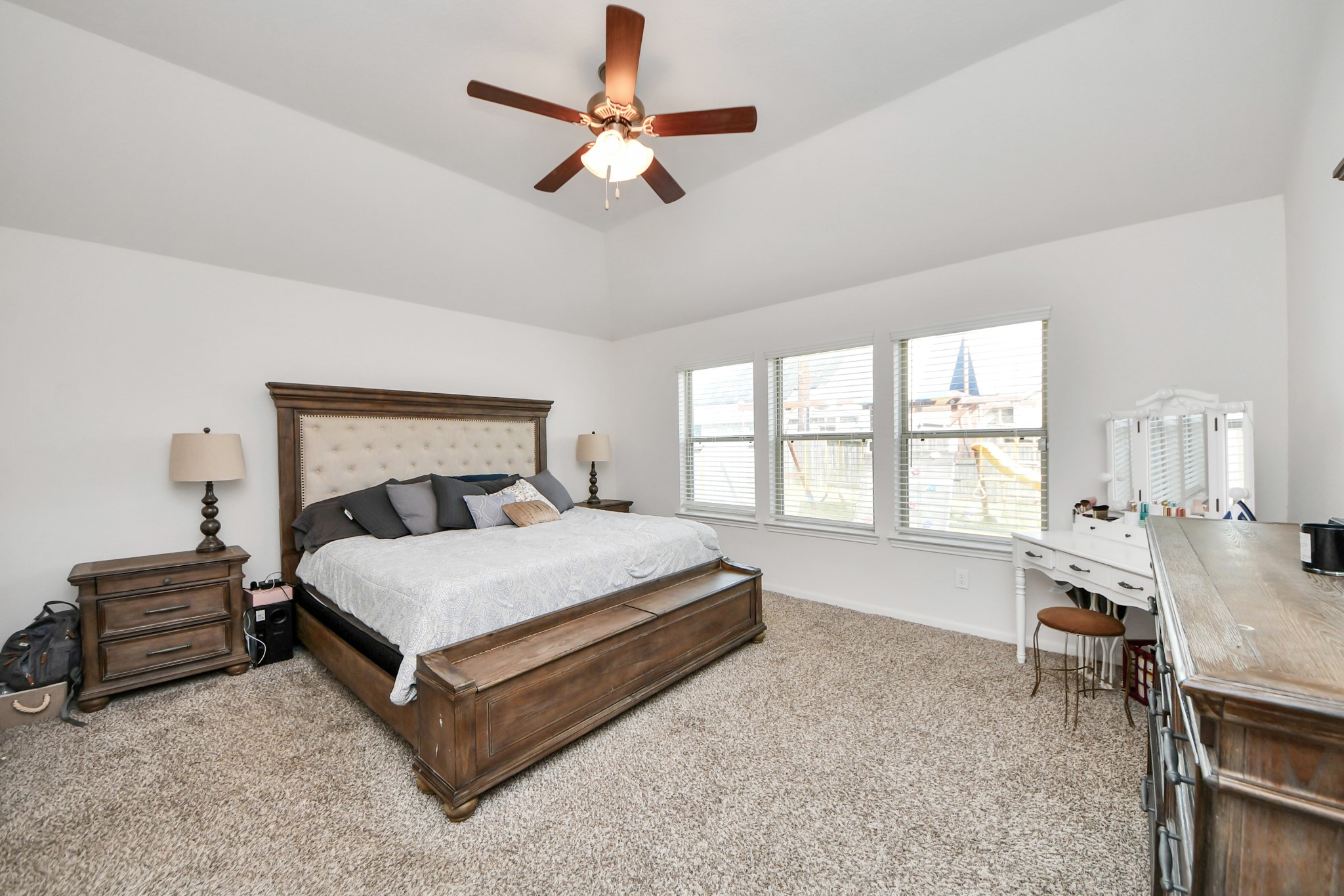 6226 Mason Way Rosenberg, TX 77471 - Photo 12 of 30 a bedroom with a bed a chandelier and a window