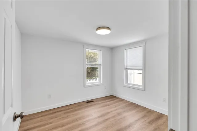 a picture of a bench in a white wall