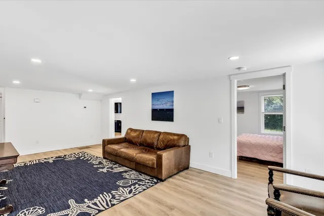 a kitchen with granite countertop a refrigerator stove and sink