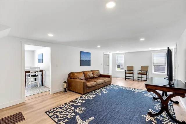 a view of entryway with wooden floor and stairs