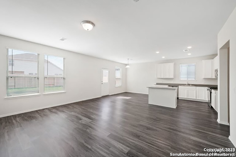 11264 Long Rider San Antonio, TX 78254 - Photo 2 of 11 a view of kitchen with wooden floor and window
