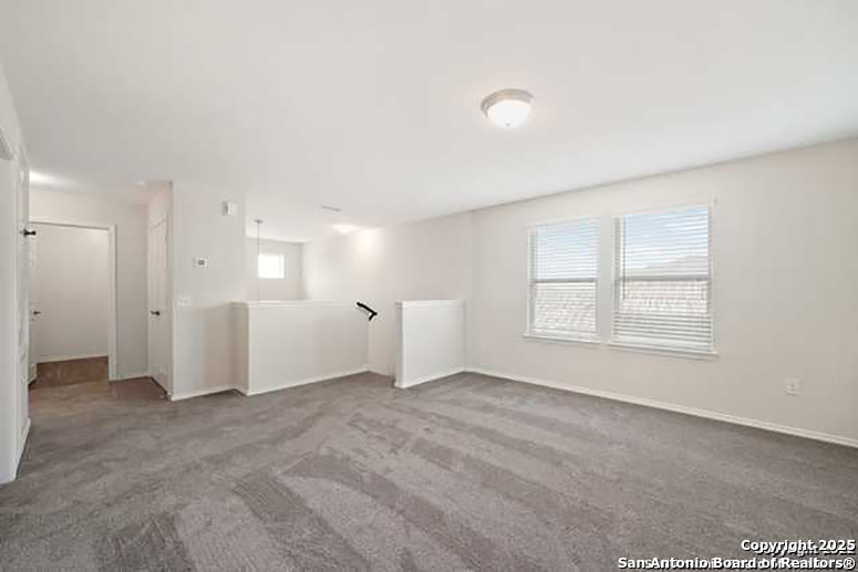 11264 Long Rider San Antonio, TX 78254 - Photo 5 of 11 a view of an empty room with a window