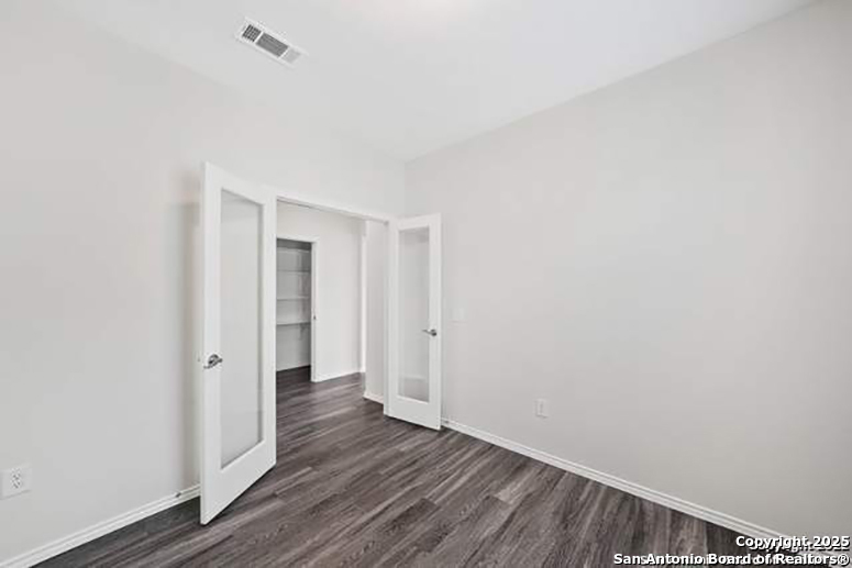 11264 Long Rider San Antonio, TX 78254 - Photo 7 of 11 a view of an empty room with wooden floor
