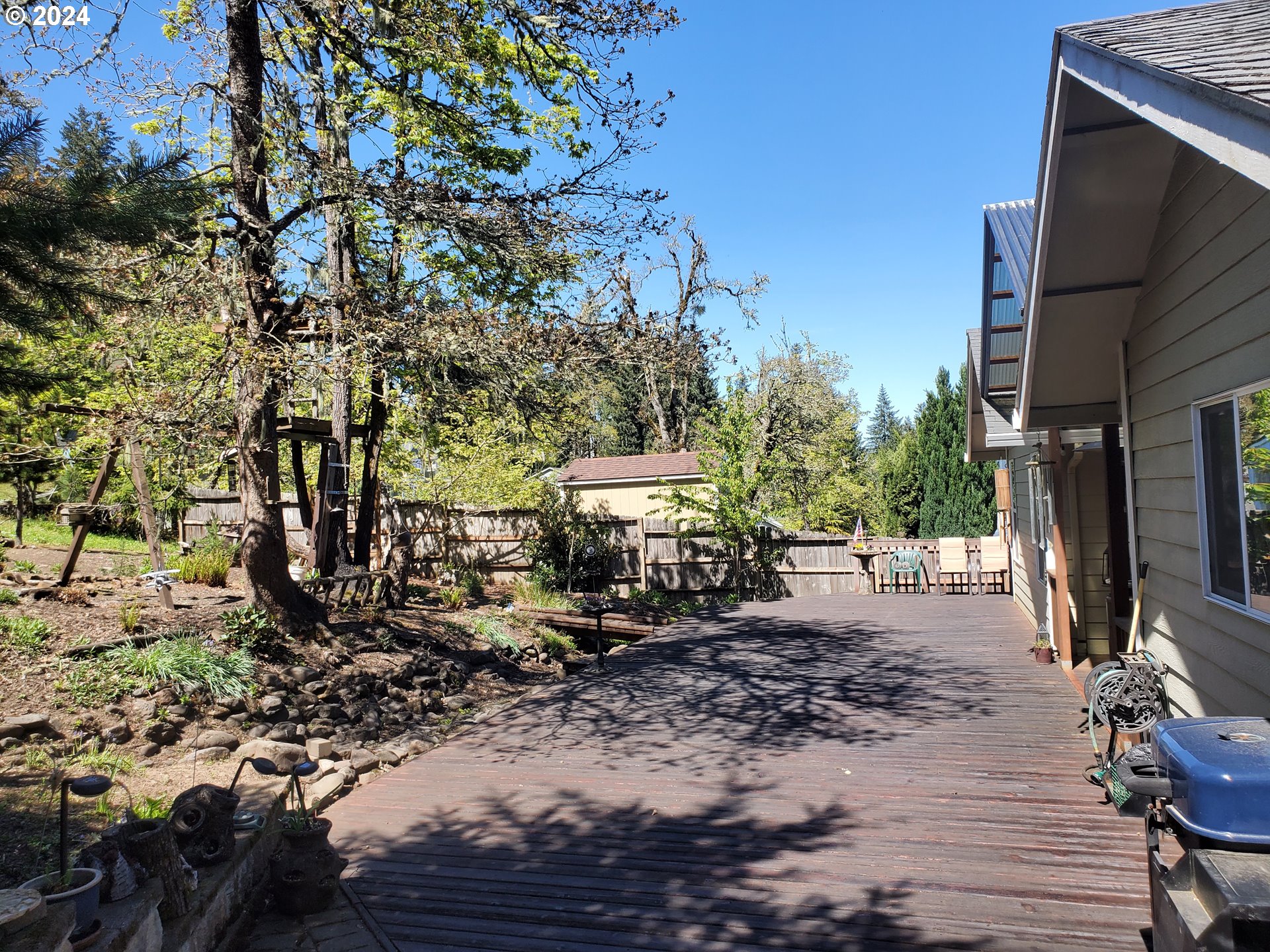 952 South 67th Street Springfield, OR 97478 - Photo 32 of 44 a view of a chairs and fire pit in front of a house