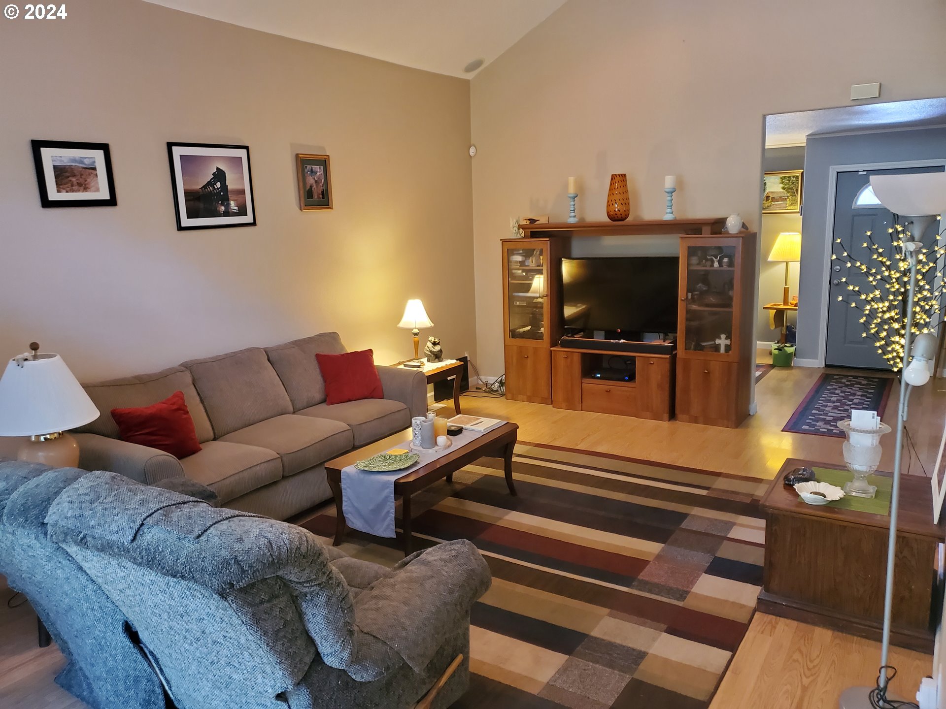 952 South 67th Street Springfield, OR 97478 - Photo 7 of 44 a living room with furniture and a flat screen tv