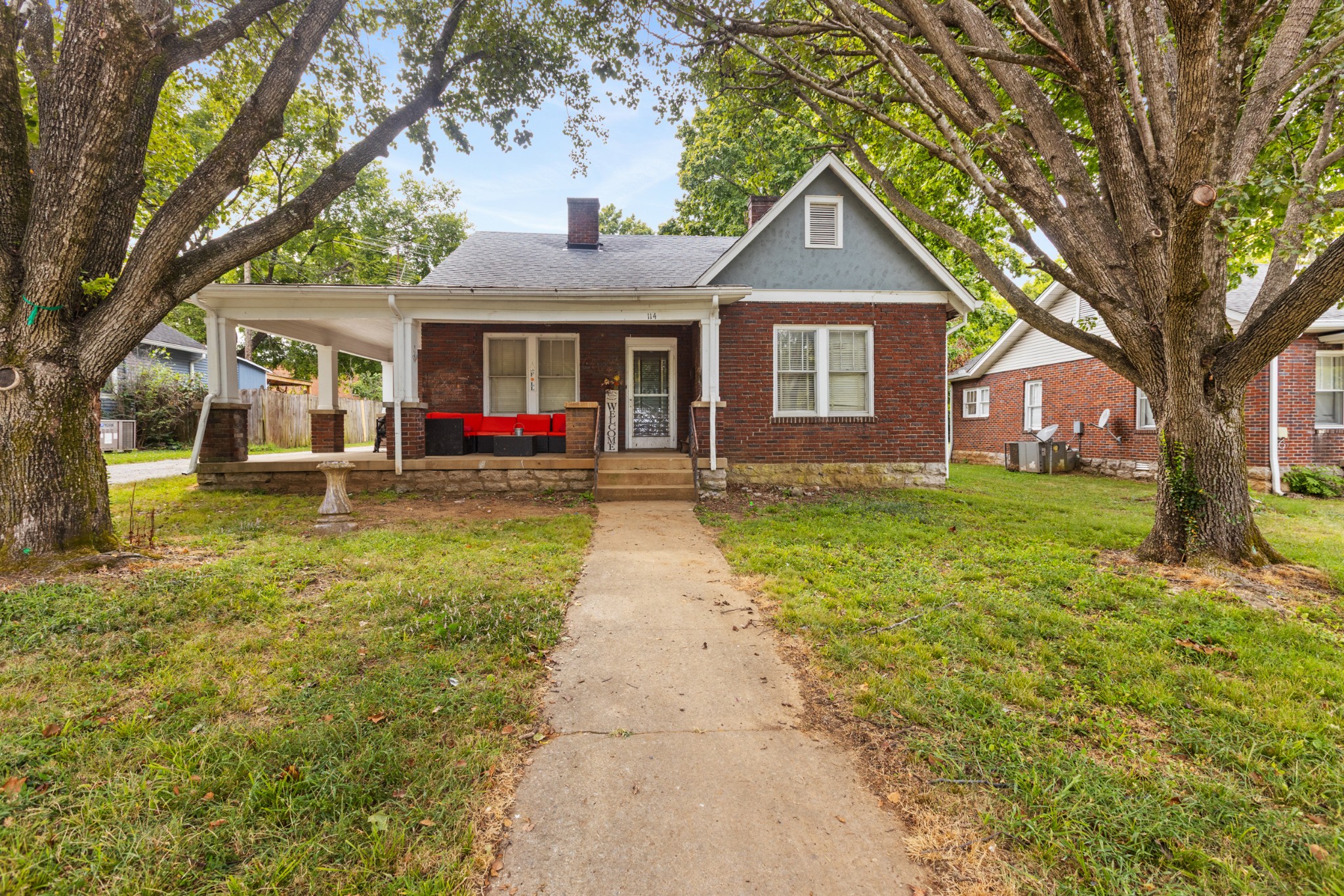 a front view of a house with garden