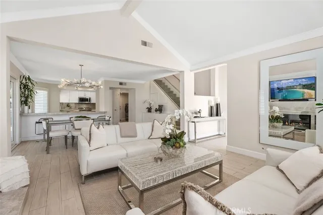 a room with a sink and a potted plant