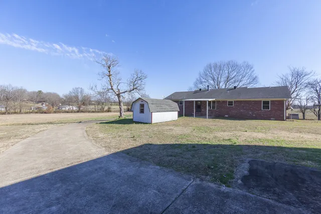 a view of a backyard of the house