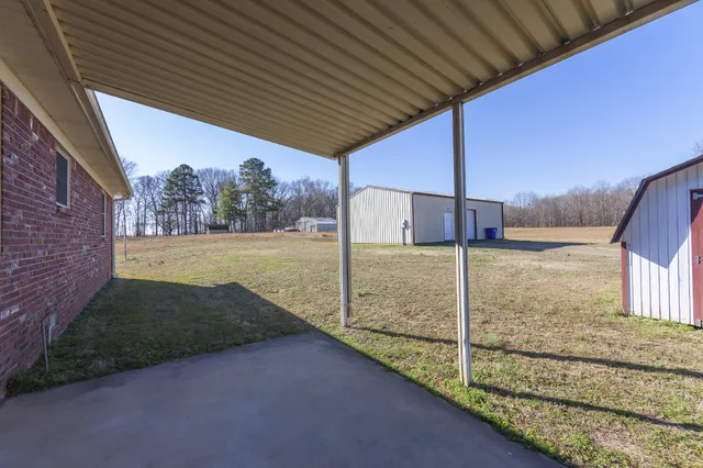 a aerial view of a house with a yard