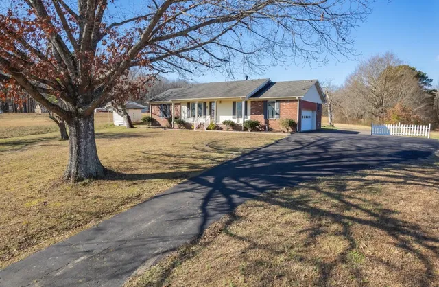 a front view of a building with a yard