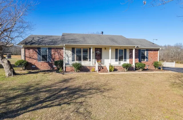 front view of a house with a yard