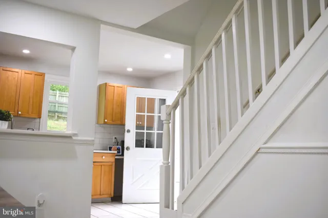 a view of swimming pool with a lounge chairs