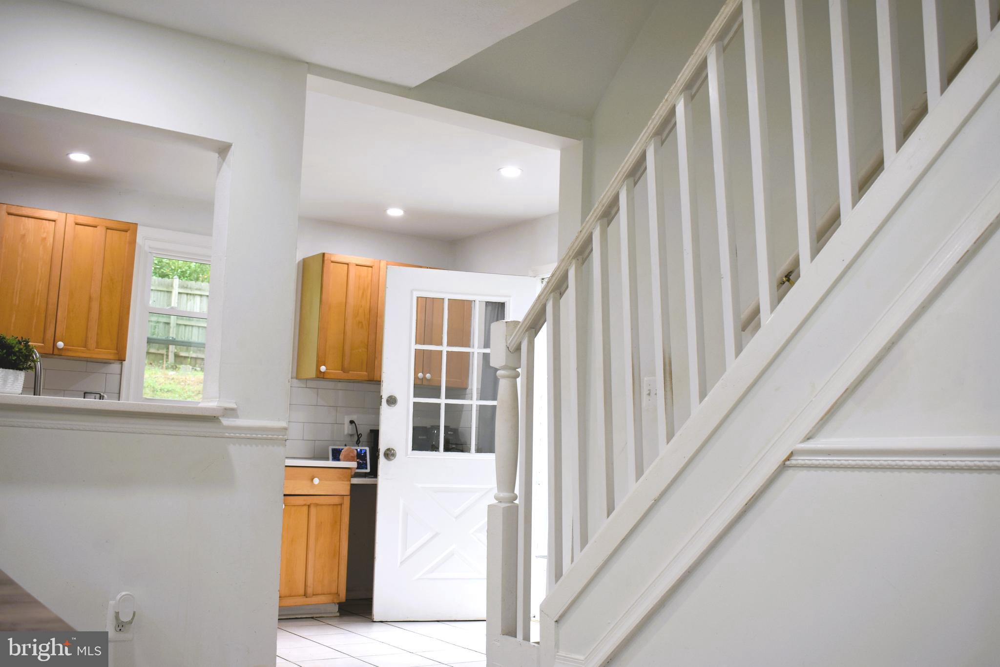 19127 Windsor Road Triangle, VA 22172 - Photo 22 of 33 a view of staircase with open kitchen view