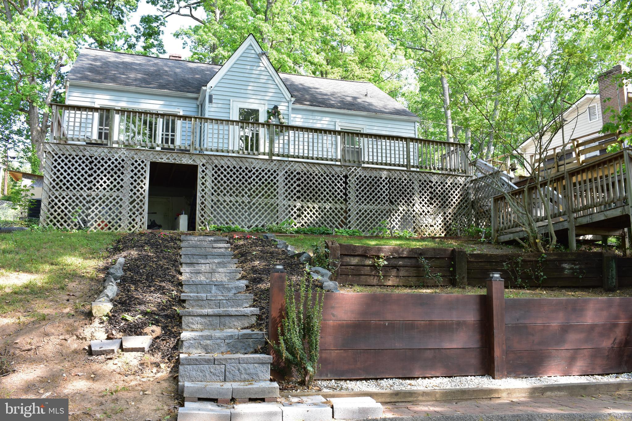19127 Windsor Road Triangle, VA 22172 - Photo 3 of 33 a front view of a house with a yard
