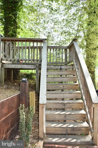 a view of a house with large windows and a wooden floor