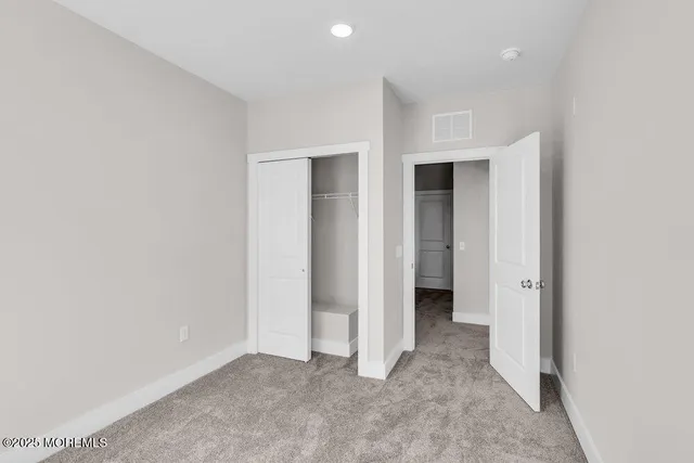 an empty room with a bathroom