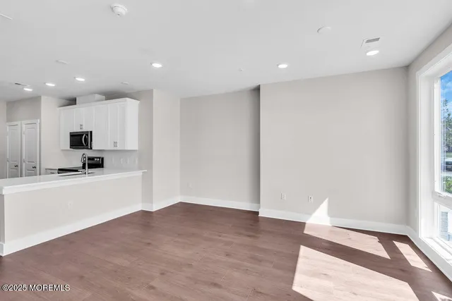 a view of kitchen with wooden floor