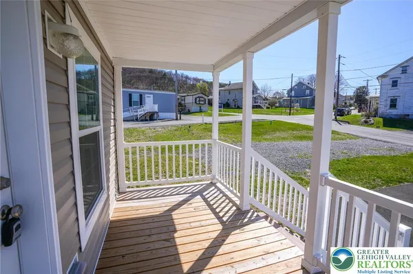 a view of a deck with a yard