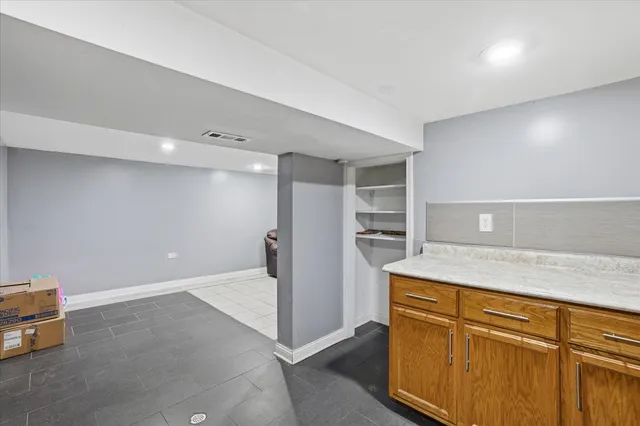 a kitchen with a refrigerator and countertop