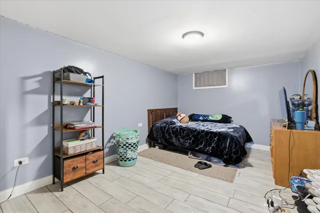a spacious bedroom with a bed and cabinets