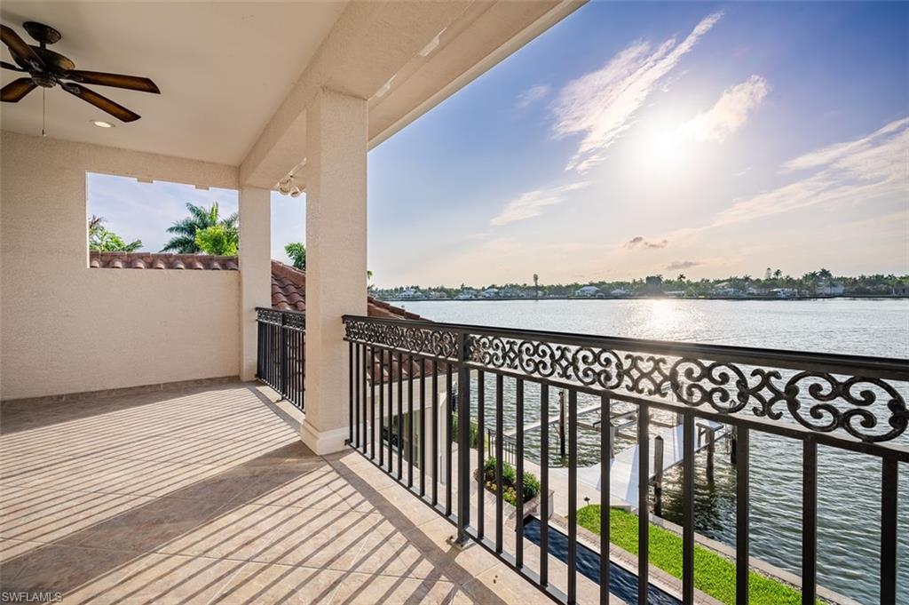 1942 Kingfish Road Naples, FL 34102 - Photo 37 of 43 a view of a balcony with wooden floor