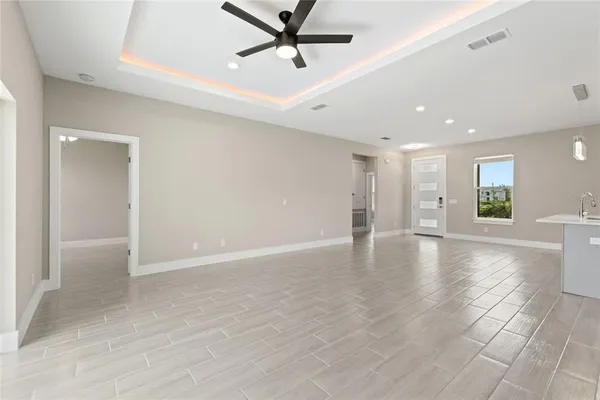 a view of kitchen with refrigerator a microwave and stove