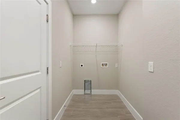 a view of a backyard with plants and a garden