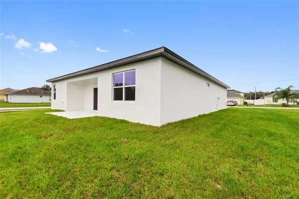a backyard of a house with lots of green space