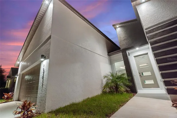 a view of a livingroom with wooden floor and a window