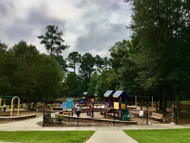 a view of a chairs and table in patio with a yard