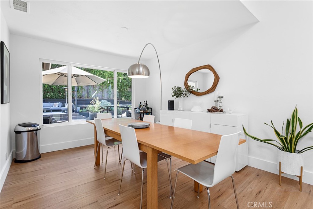5555 Fairview Place Agoura Hills, CA 91301 - Photo 13 of 39 a view of a dining room with furniture window and wooden floor